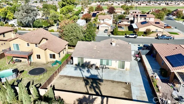 an aerial view of residential houses with yard