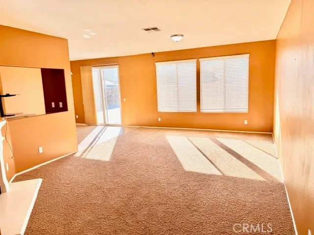 a view of living room with furniture and a fireplace