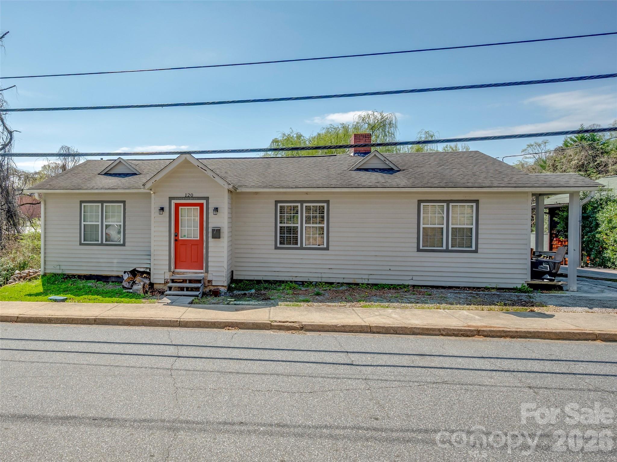 120 East Howard Street Tryon, NC 28782 - Photo 5 of 31 a view of a house with a patio