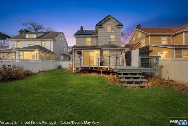 a front view of house with yard and outdoor seating