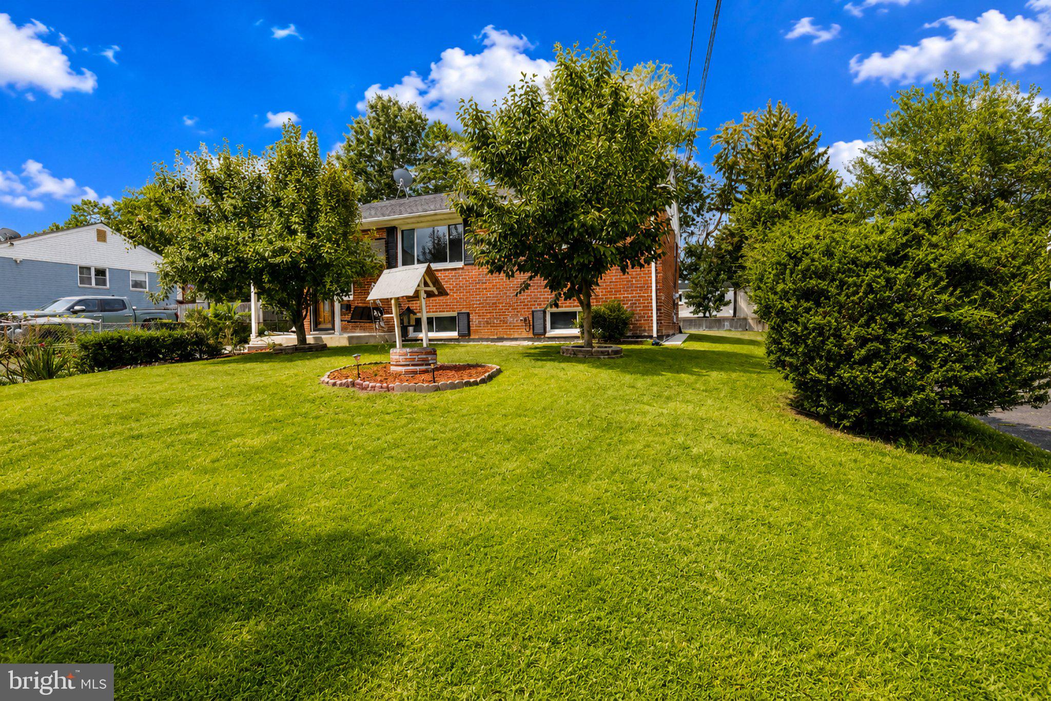 5712 Ash Drive Springfield, VA 22150 - Photo 36 of 38 Charming home with lush green lawn.