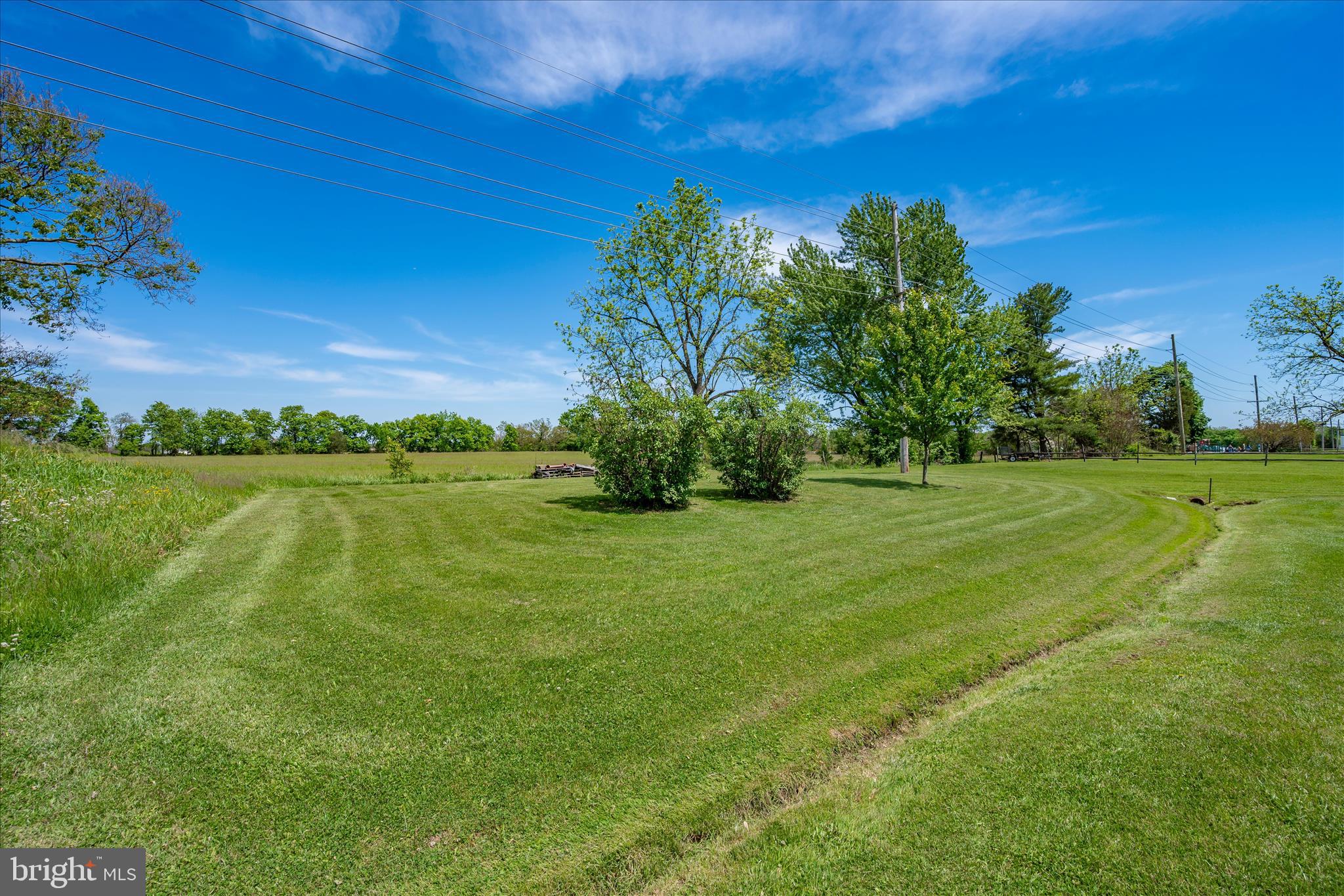 11205 Hessong Bridge Road Thurmont, MD 21788 - Photo 64 of 69 a view of a garden with a building in the background