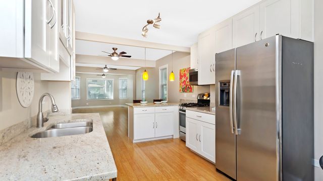 a kitchen with a sink stove and refrigerator