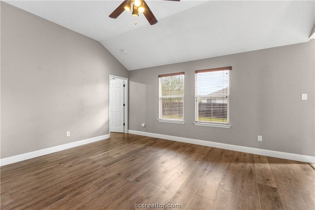 3709 Springfield Drive College Station, TX 77845 - Photo 4 of 23 an empty room with wooden floor and windows