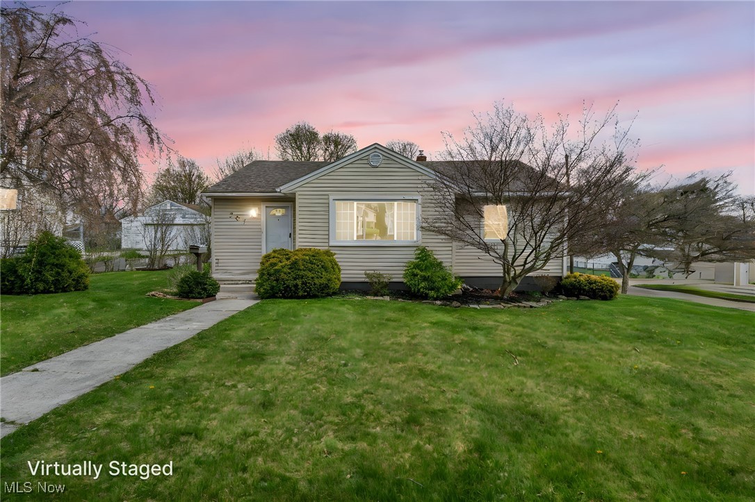 Bungalow-style home featuring a front lawn