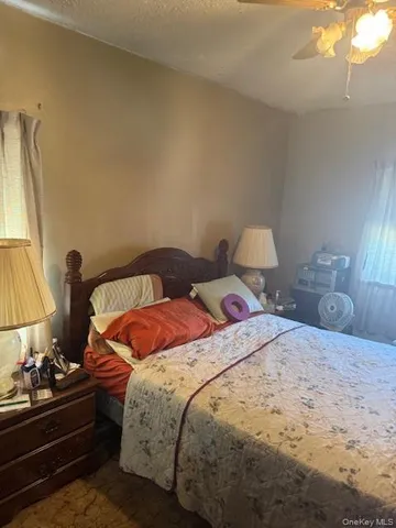 a bedroom with a bed and window