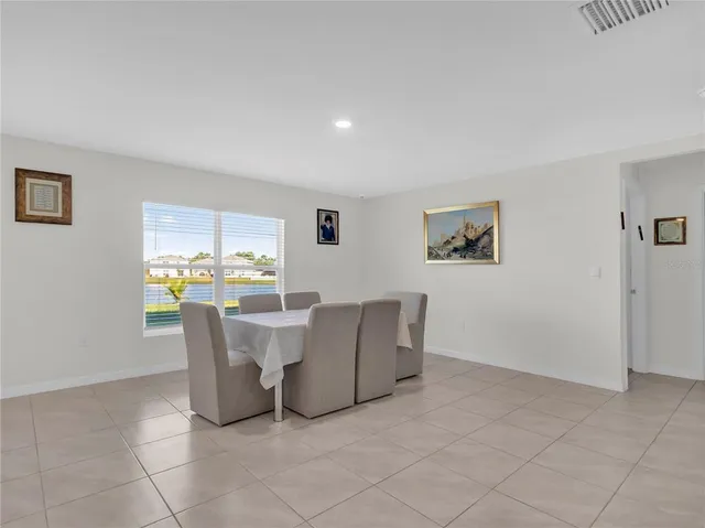 a view of a livingroom with furniture and a window