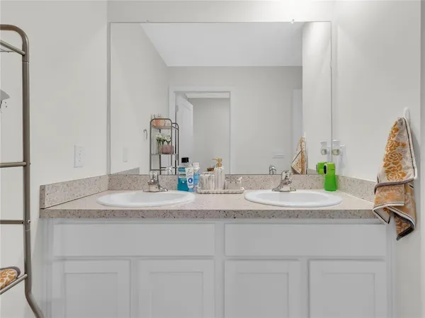 a white toilet sitting next to a shower curtain