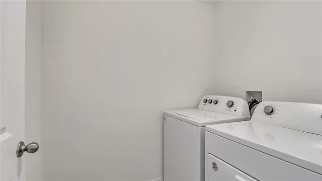 an aerial view of a house with a garden and outdoor seating