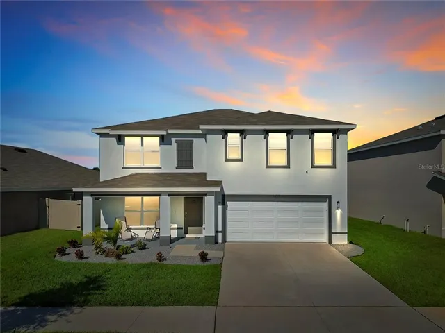 a view of multiple houses with outdoor space