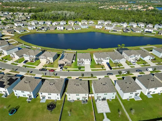 an aerial view of a pool yard patio and outdoor seating