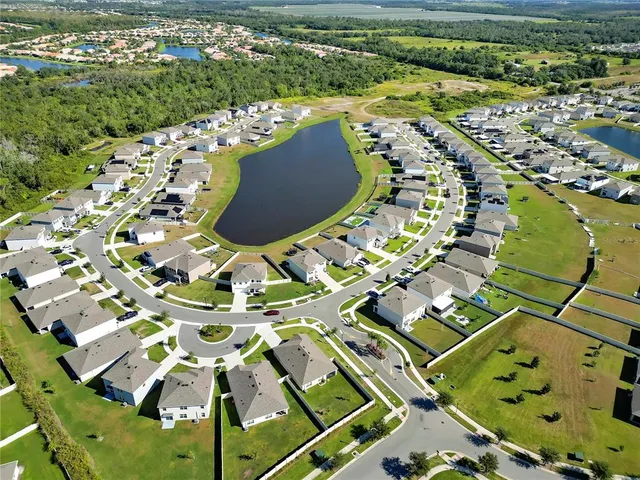 an aerial view of a house with a garden
