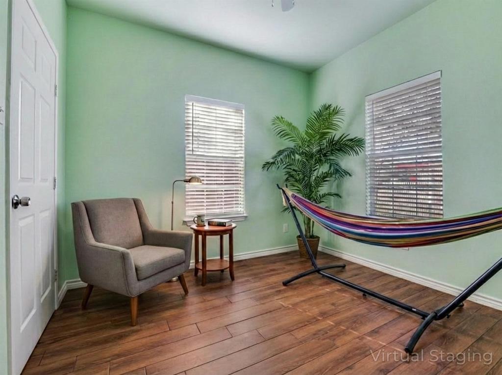 2410 Carleta Street Dallas, TX 75253 - Photo 11 of 20 a room with chairs and a window