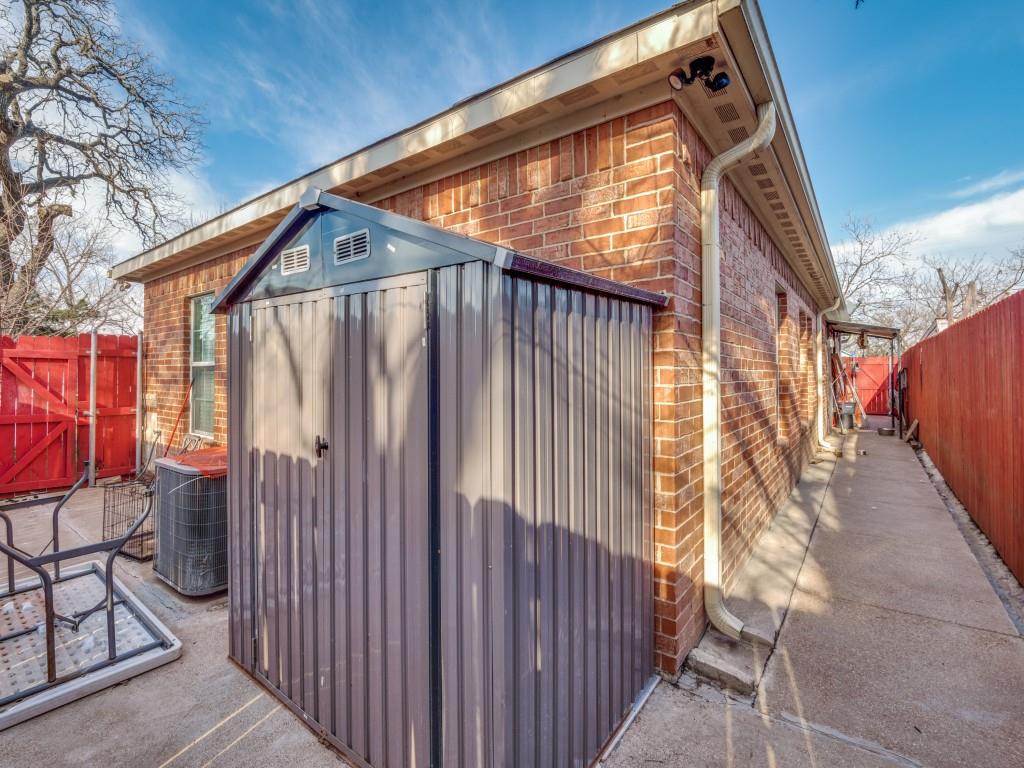 2410 Carleta Street Dallas, TX 75253 - Photo 18 of 20 a view of wooden house with a small yard