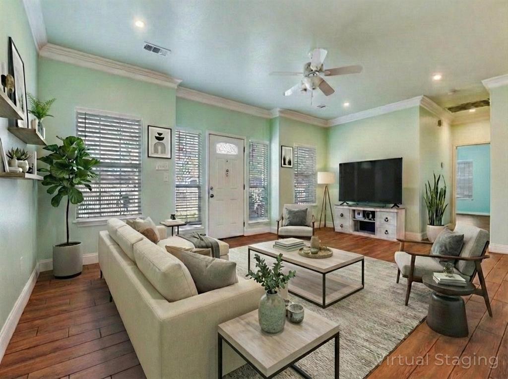 2410 Carleta Street Dallas, TX 75253 - Photo 3 of 20 a living room with furniture and a flat screen tv