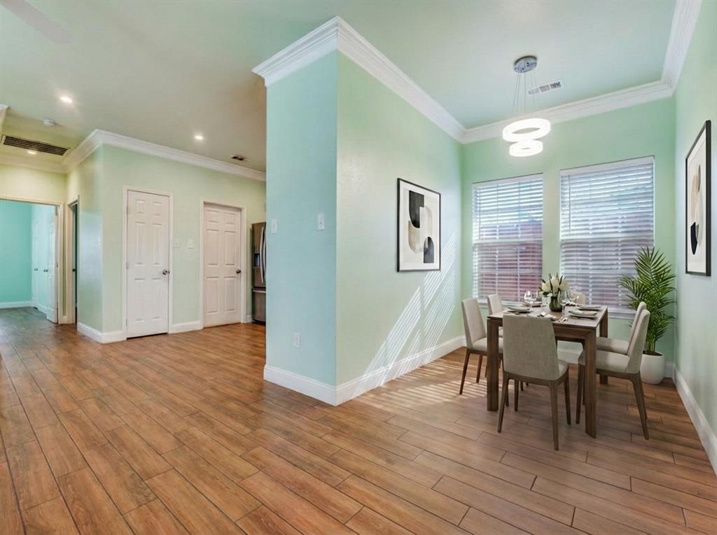 2410 Carleta Street Dallas, TX 75253 - Photo 4 of 20 a dining room with furniture and wooden floor