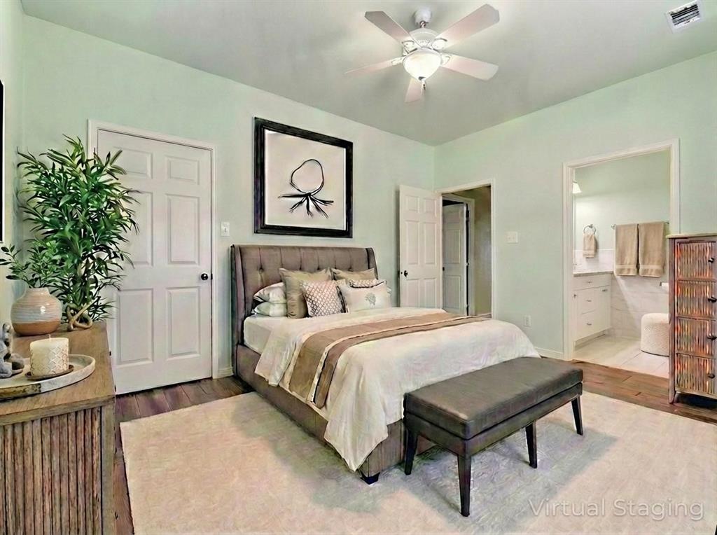 2410 Carleta Street Dallas, TX 75253 - Photo 8 of 20 a bedroom with a bed and a chandelier