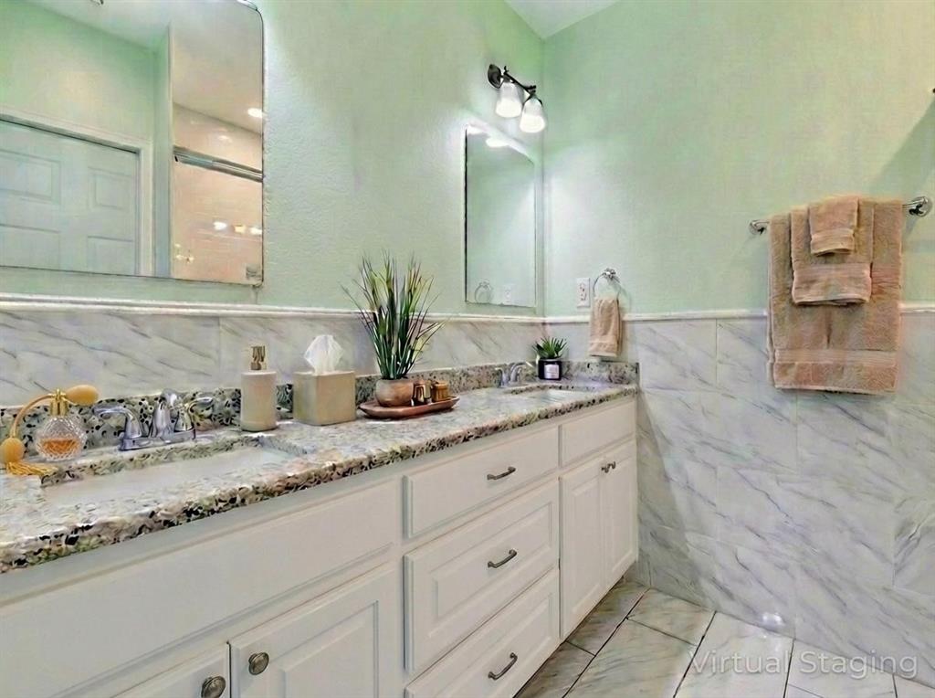 2410 Carleta Street Dallas, TX 75253 - Photo 9 of 20 a bathroom with a granite countertop sink and a mirror