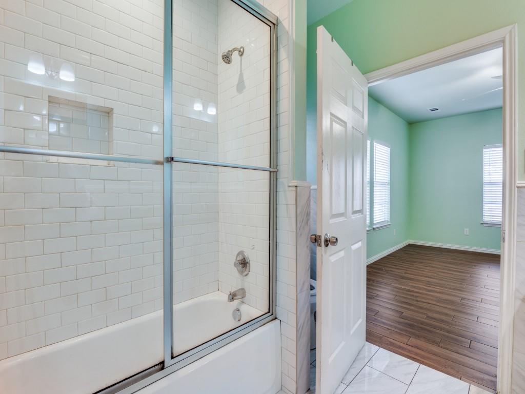 2410 Carleta Street Dallas, TX 75253 - Photo 10 of 20 a bathroom with a glass shower door