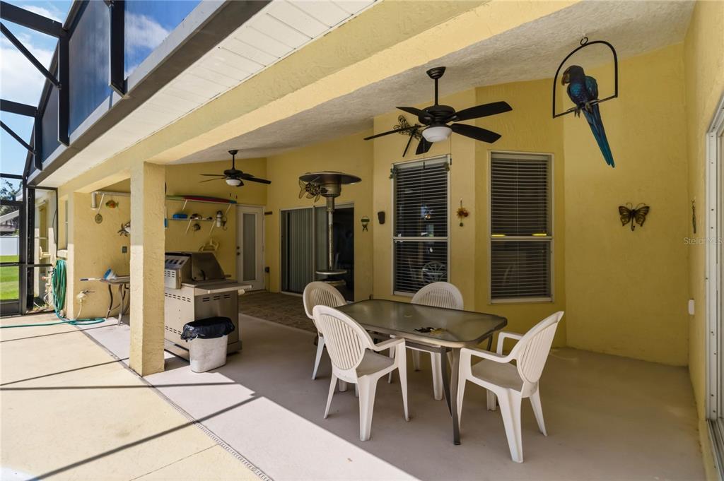 3225 Canoe Creek Road St. Cloud, FL 34772 - Photo 26 of 30 a dining room with furniture and a chandelier