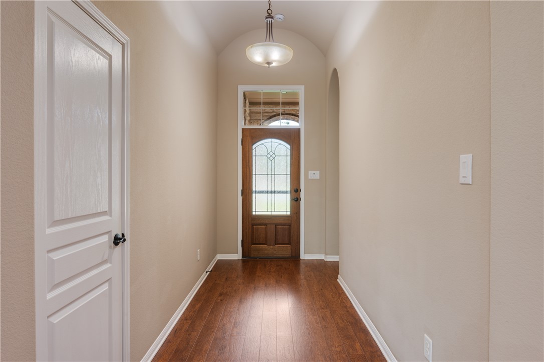 3085 Archer Circle Bryan, TX 77808 - Photo 2 of 31 a view of a hallway with wooden floor and glass door