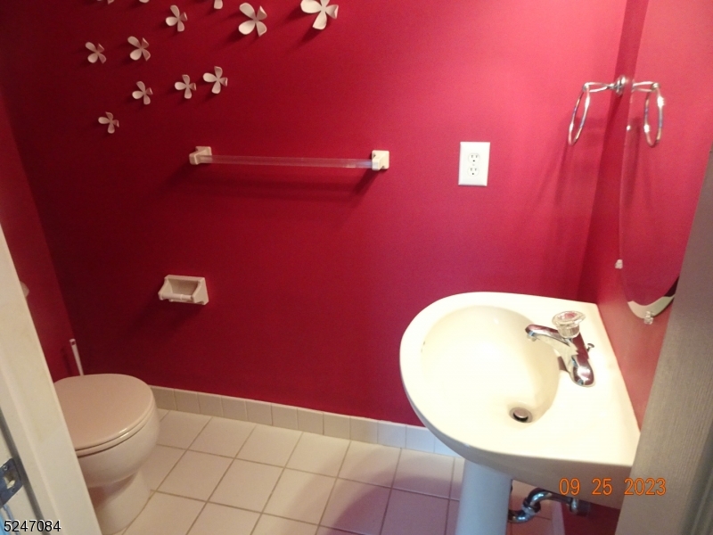 112 Limerick Lane, Unit 1 Phillipsburg, NJ 08865 - Photo 14 of 41 a bathroom with a toilet mirror and vanity