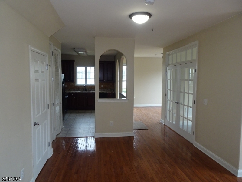 112 Limerick Lane, Unit 1 Phillipsburg, NJ 08865 - Photo 6 of 41 wooden floor in an empty room with a window