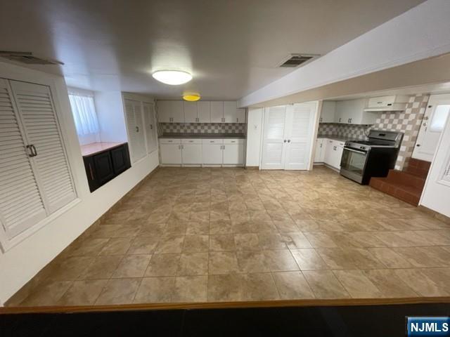 209 8th Street Fairview, NJ 07022 - Photo 14 of 41 a view of a kitchen with a sink cabinets and a window