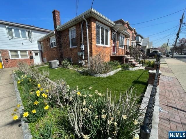 209 8th Street Fairview, NJ 07022 - Photo 2 of 41 a front view of a house with a garden