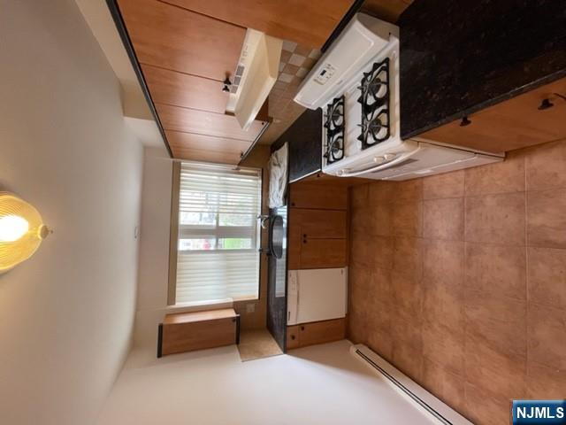 209 8th Street Fairview, NJ 07022 - Photo 21 of 41 a kitchen that has a sink and a stove