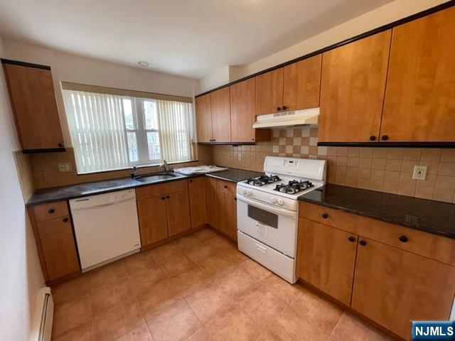 209 8th Street Fairview, NJ 07022 - Photo 22 of 41 a kitchen with granite countertop a sink cabinets and stainless steel appliances