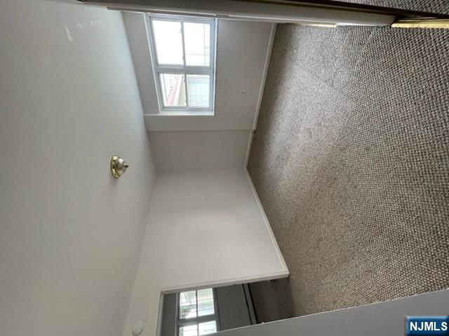 209 8th Street Fairview, NJ 07022 - Photo 27 of 41 an empty room with windows
