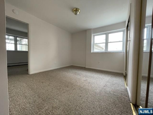 209 8th Street Fairview, NJ 07022 - Photo 30 of 41 an empty room with windows