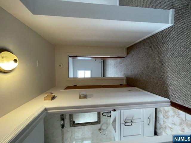 209 8th Street Fairview, NJ 07022 - Photo 32 of 41 a view of a bathroom from the hallway