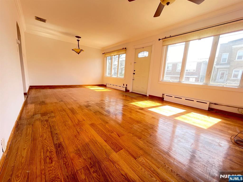 209 8th Street Fairview, NJ 07022 - Photo 6 of 41 a view of an empty room with a window