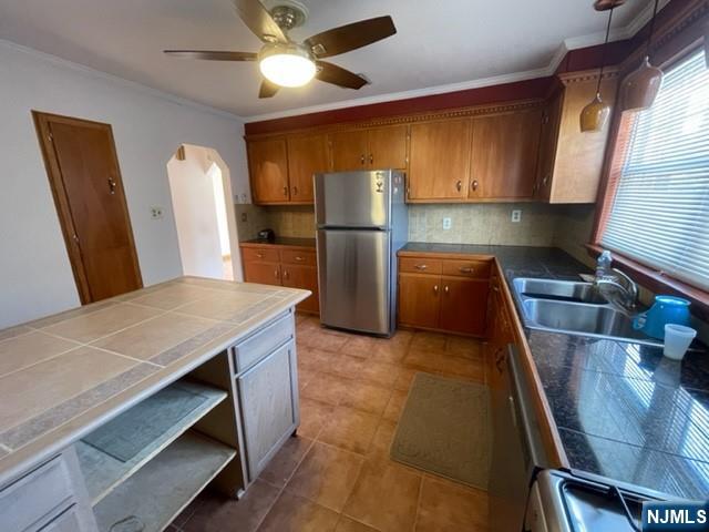 209 8th Street Fairview, NJ 07022 - Photo 7 of 41 a kitchen with stainless steel appliances granite countertop a sink refrigerator and microwave