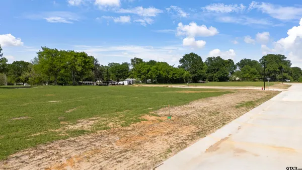 a view of a lake with a big yard