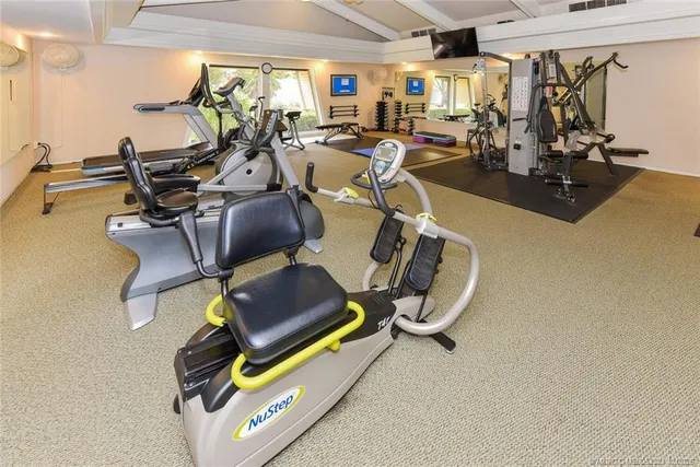 a kitchen with a sink stainless steel appliances and cabinets