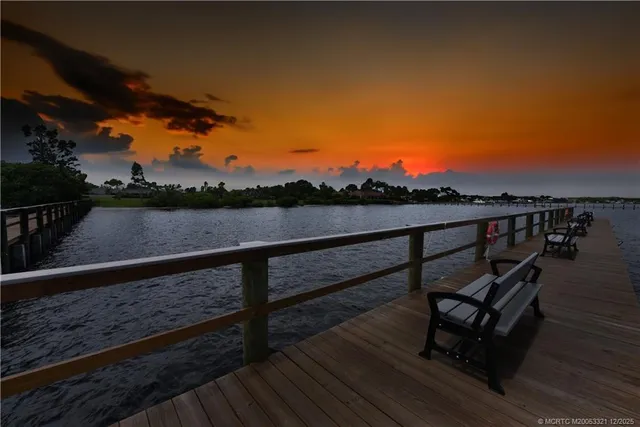 a view of wooden floor with a bench