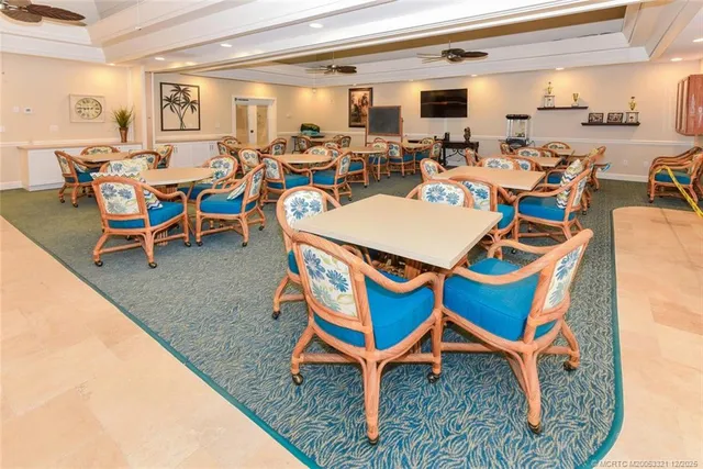 a view of a chairs and table in the patio