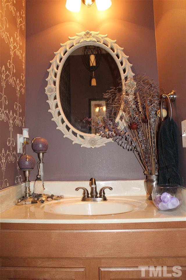 2812 Orchard Trace Way Raleigh, NC 27610 - Photo 13 of 24 This half bathroom is located on the first floor