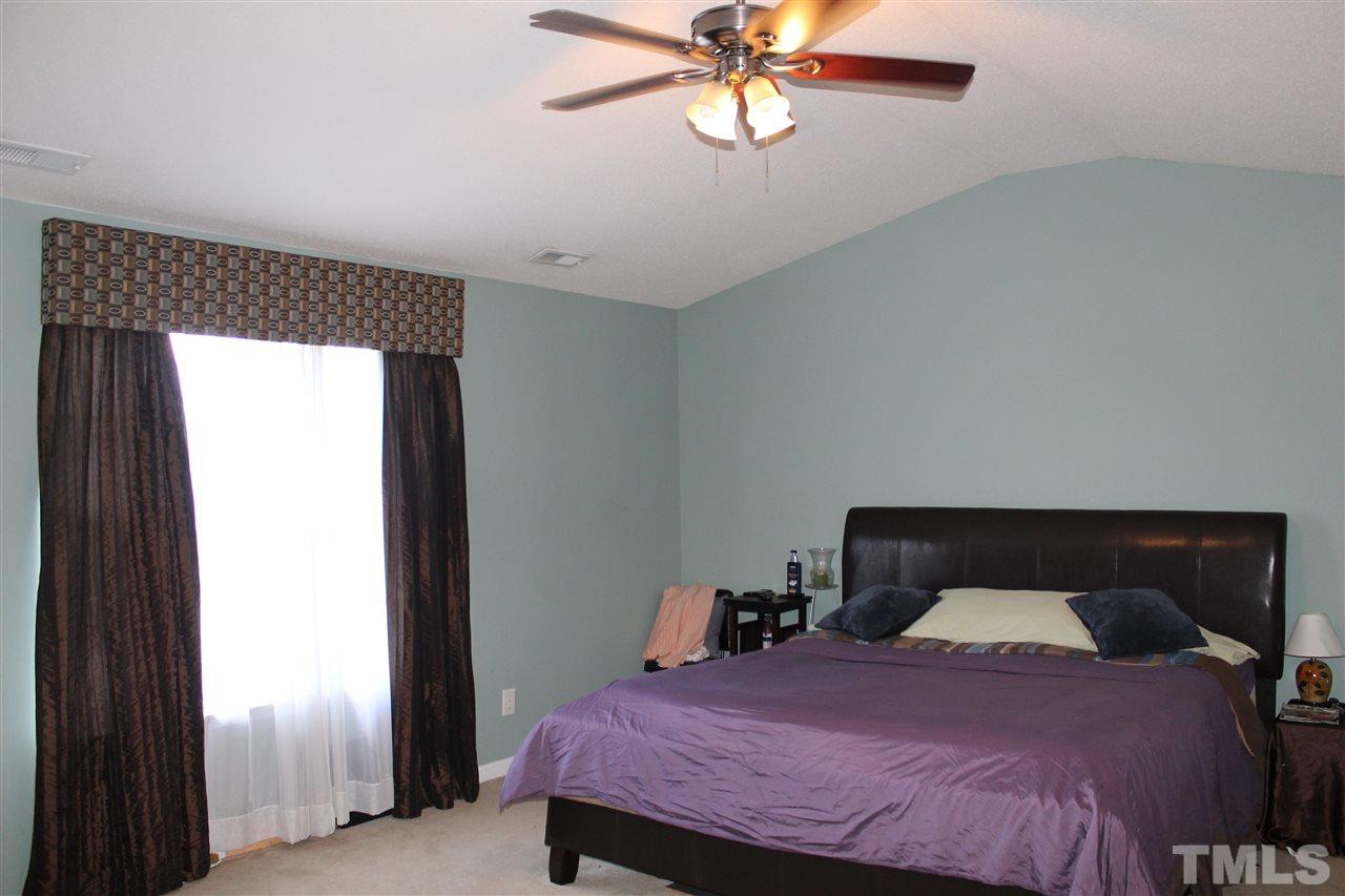 2812 Orchard Trace Way Raleigh, NC 27610 - Photo 15 of 24 Extra large master bedroom with tall ceiling and fan, measures 18 x 14.9