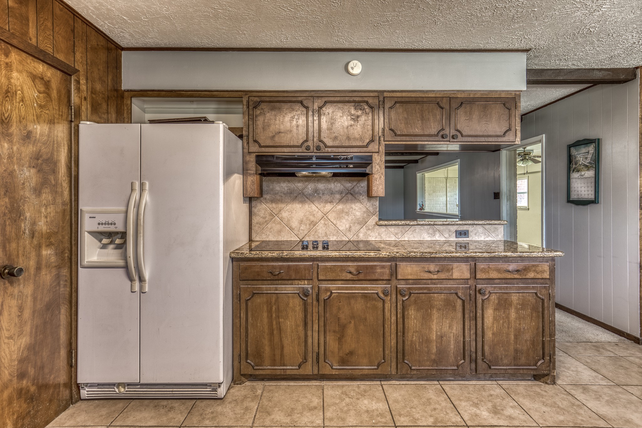 1687 Eagle Lake Road Sealy, TX 77474 - Photo 12 of 27 a kitchen with stainless steel appliances granite countertop a refrigerator and a stove