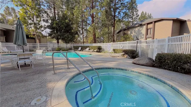 a view of a swimming pool with a patio