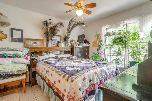 a bed room with a bed and a chandelier