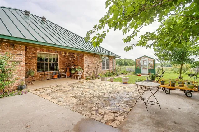 a house with swimming pool in front of it