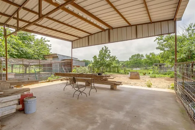 a view of a swimming pool with a patio