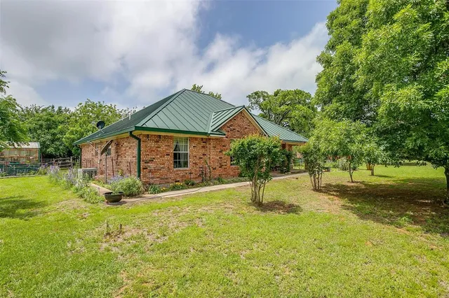 a house with garden in front of it