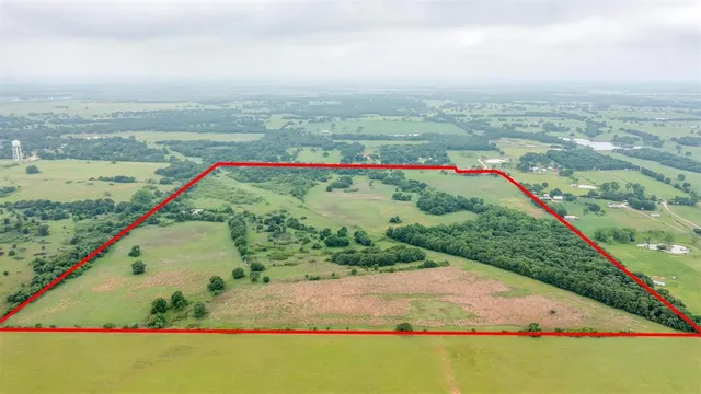 a view of a lake with a yard