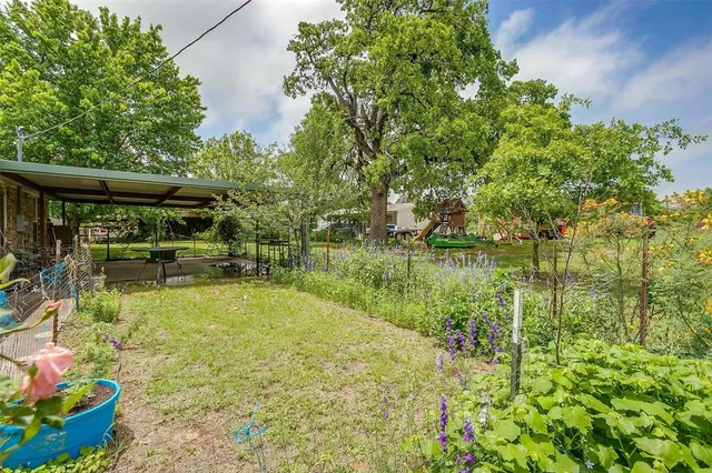 a view of a lake with a house in the background